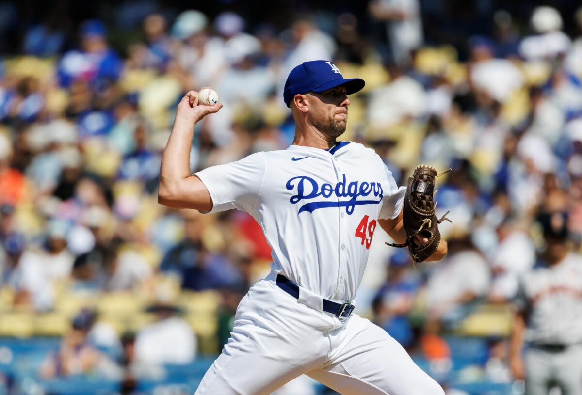 Dodgers reliever Blake Treinen delivers a pitch against the Giants during a game in July at Dodger Stadium.