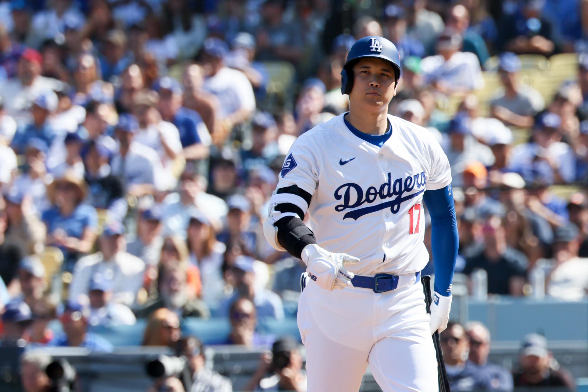 Dodgers star Shohei Ohtani reacts after striking out in the first inning against the Mets.