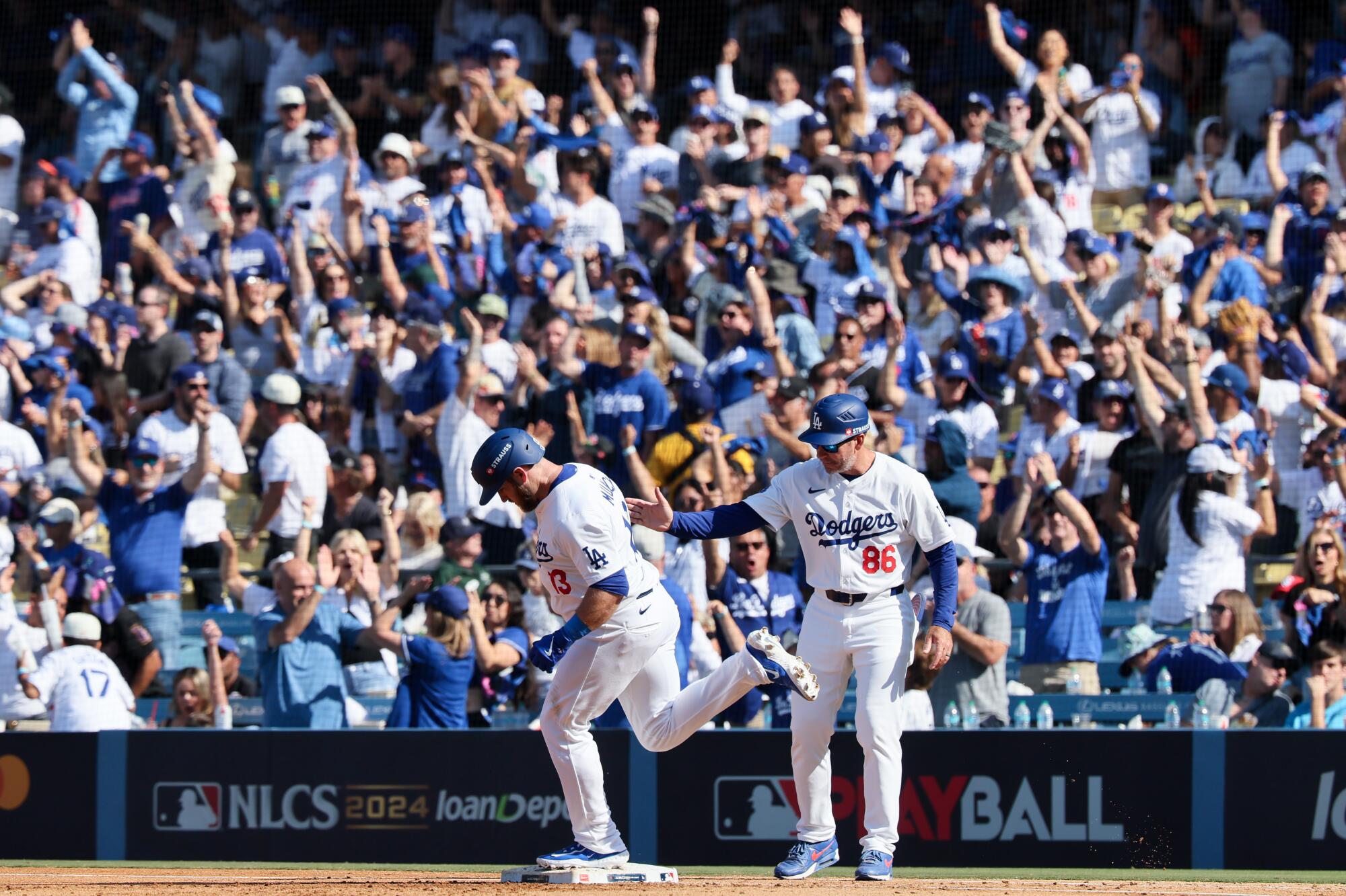 Max Muncy celebrates after hitting a solo home run in the fifth inning of Game 2 of the NLCS at Dodger Stadium.