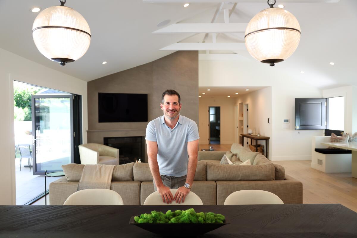 Real estate agent Ben Belack stands in the living room of a house he has listed for sale in Brentwood. 