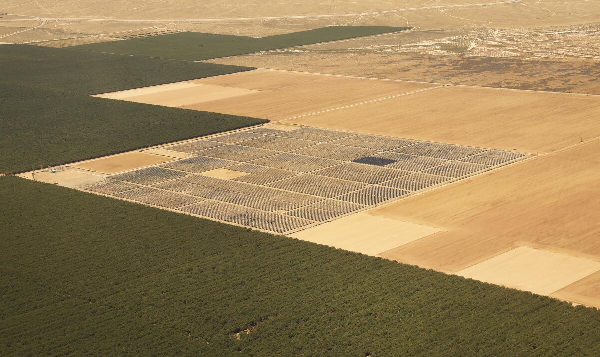 A solar project is surrounded by farmland in the San Joaquin Valley.