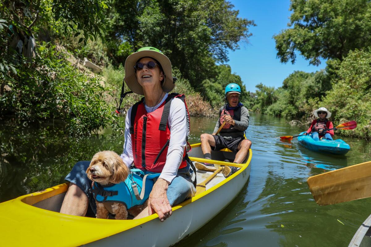 Melanie Winter floats along the Los Angeles River in the Sepulveda Basin.