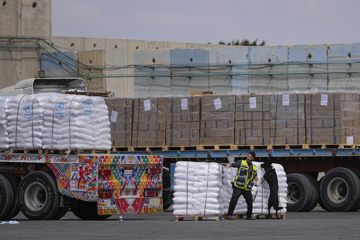 Loaded-up trucks are inspected