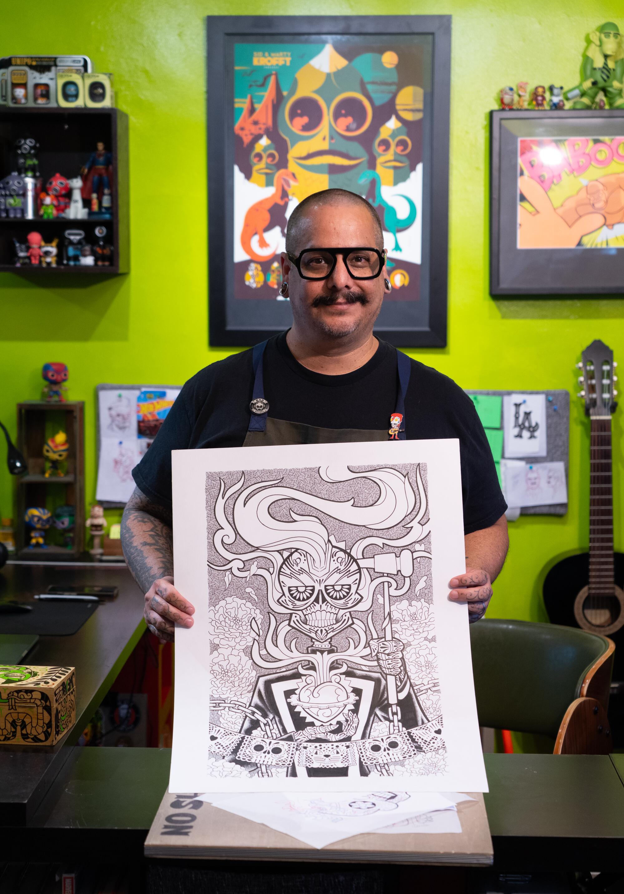  J. Gonzo holds up a black-and-white version of his Marvel Comics cover for "Ghost Rider."