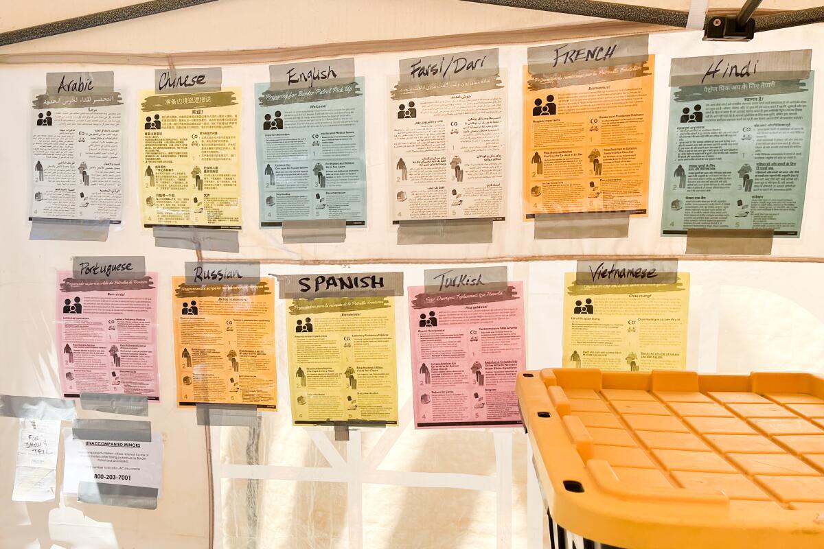 Health notices in different languages at a field camp run by the American Friends Service Committee at the border in San Diego.