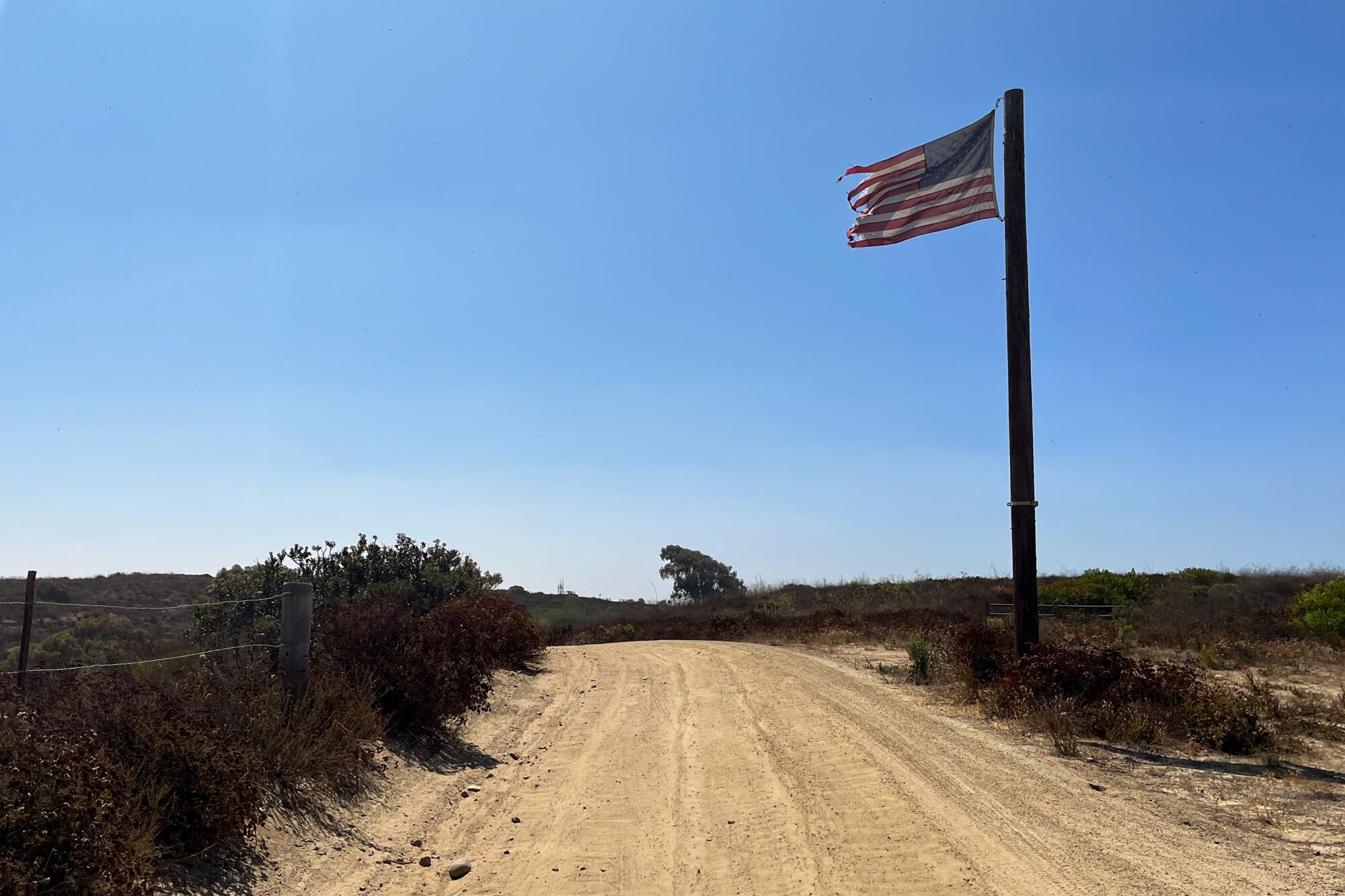 A U.S. flag flies near the Mexican border in Tijuana River Valley Regional Park.