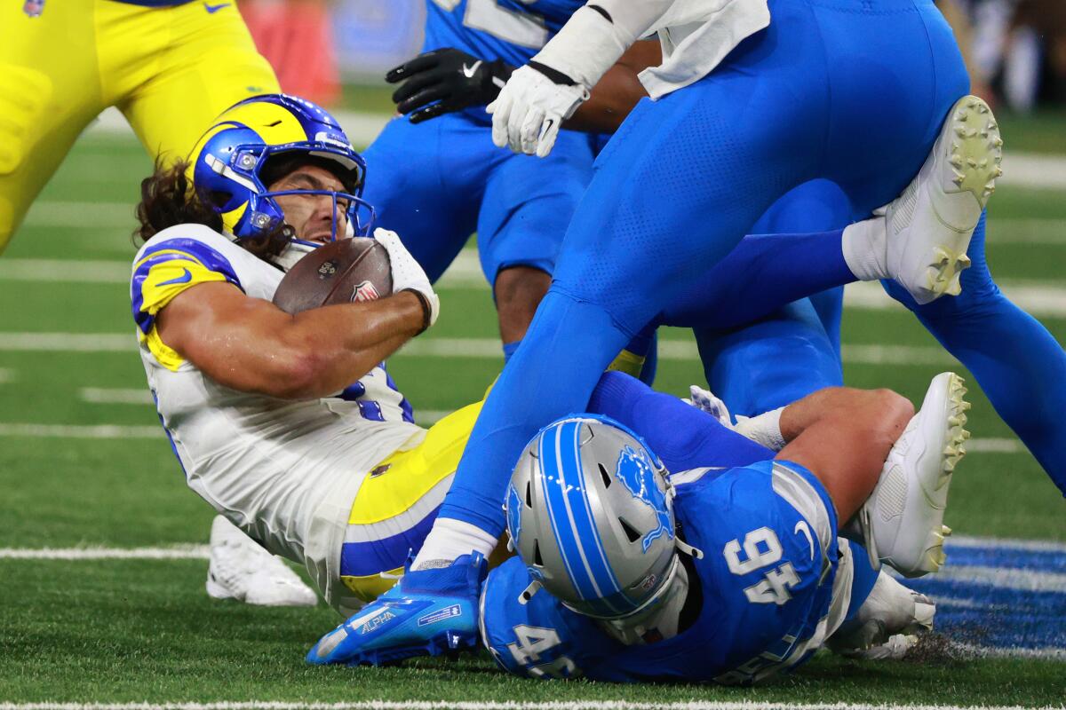  Rams wide receiver Puka Nacua (17) is tackled by  Lions linebacker Jack Campbell (46) in Week 1. 