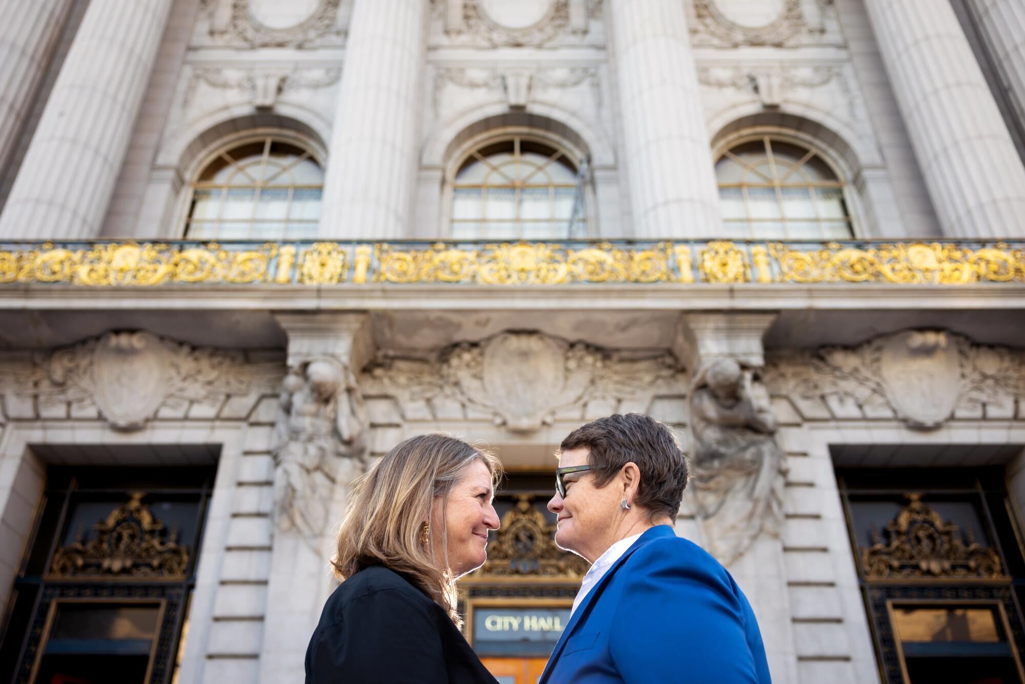 Sandy Stier, left, and Kris Perry in front of San Francisco City Hall.