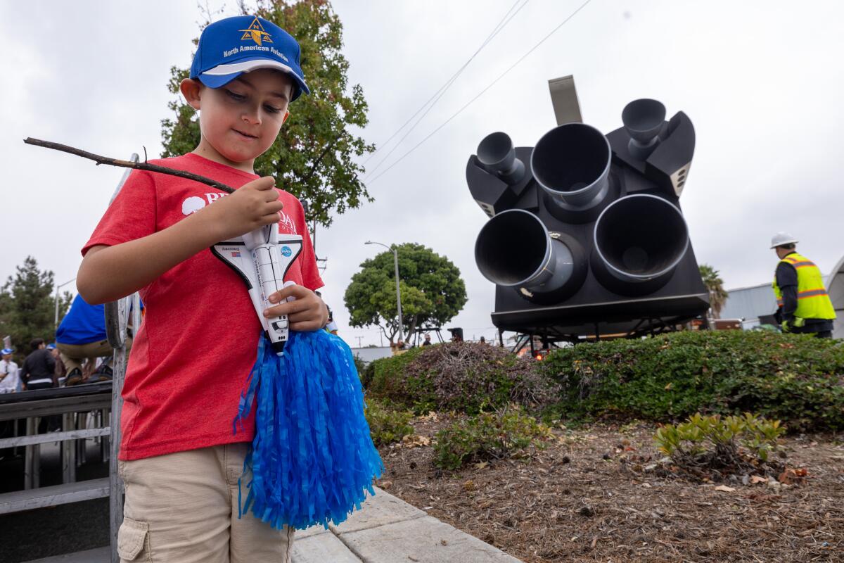 Downey, CA - October 17: Gilbert Bevenflorez III, 6, (cq) plays with a small scale m