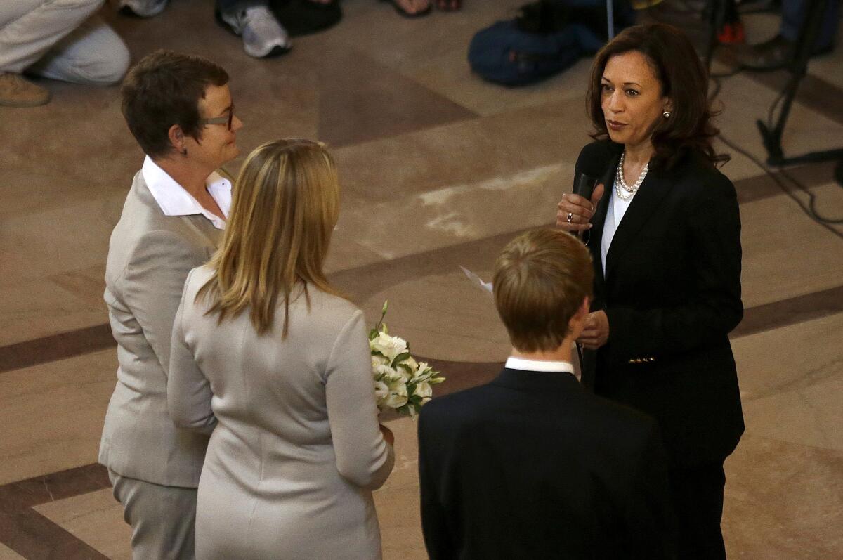 Then-California Atty. Gen. Kalama Harris officiates the wedding of Kris Perry and Sandy Stier in 2013.