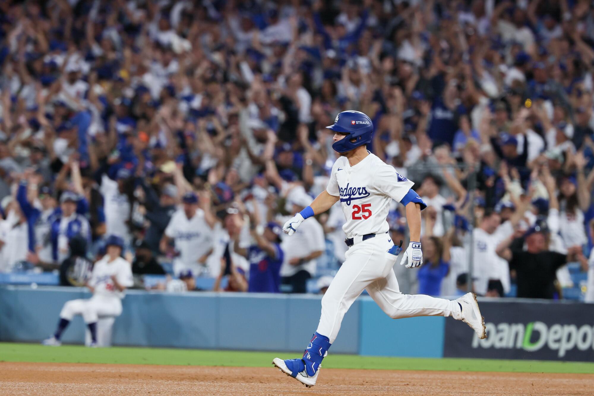 Dodgers shortstop Tommy Edman runs the bases after hitting a two-run home run.