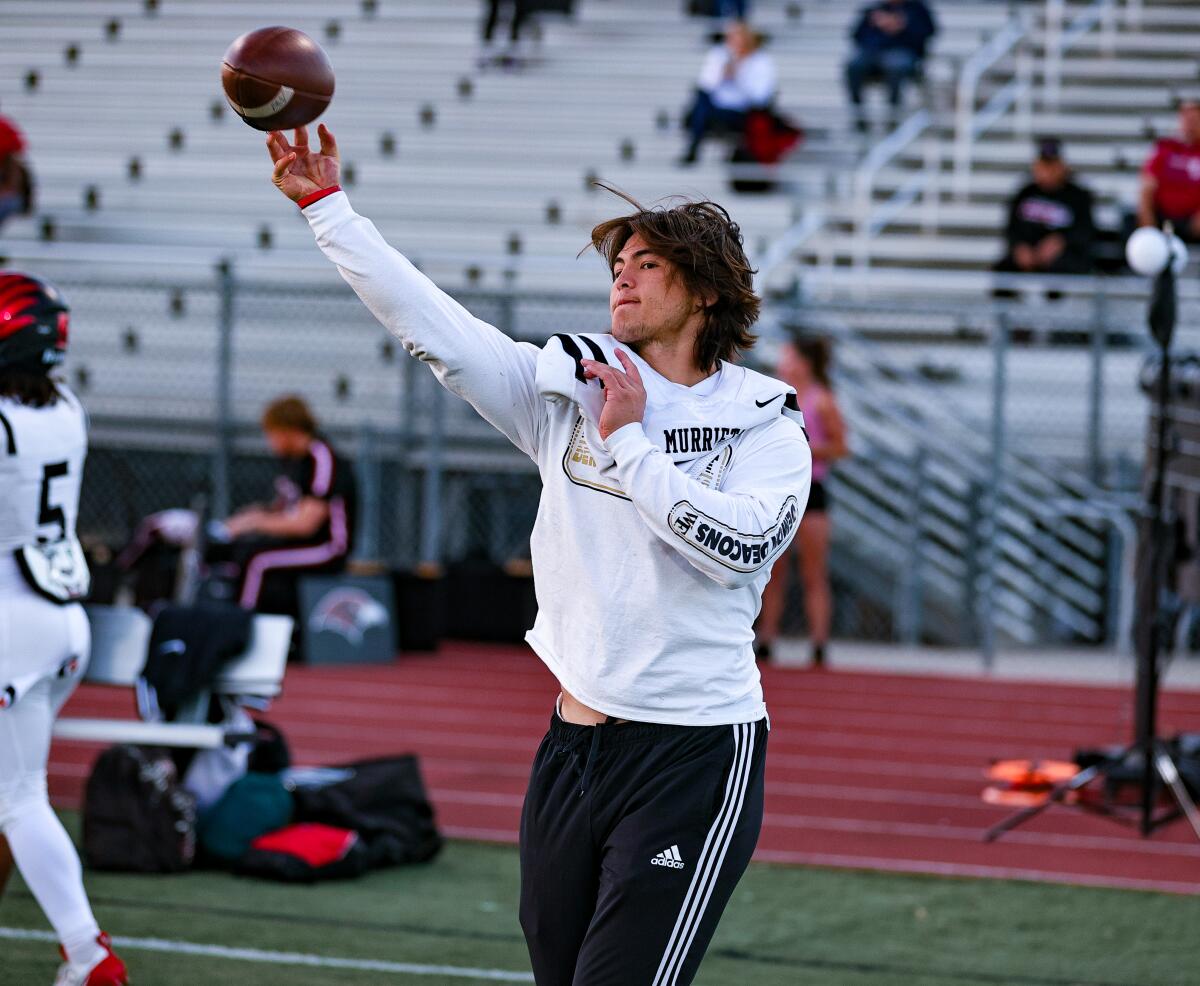 Bear Bachmeier of Murrieta Valley practicing his throwing while waiting to heal from a knee injury.