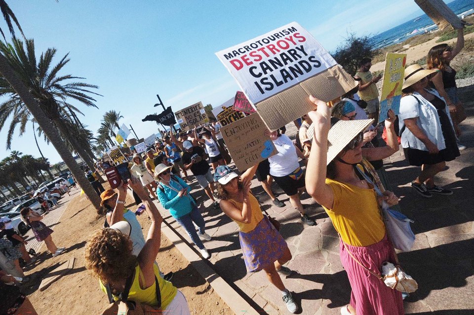 Furious anti-tourism protesters in Tenerife stormed a beach at a Brit holiday hotspot