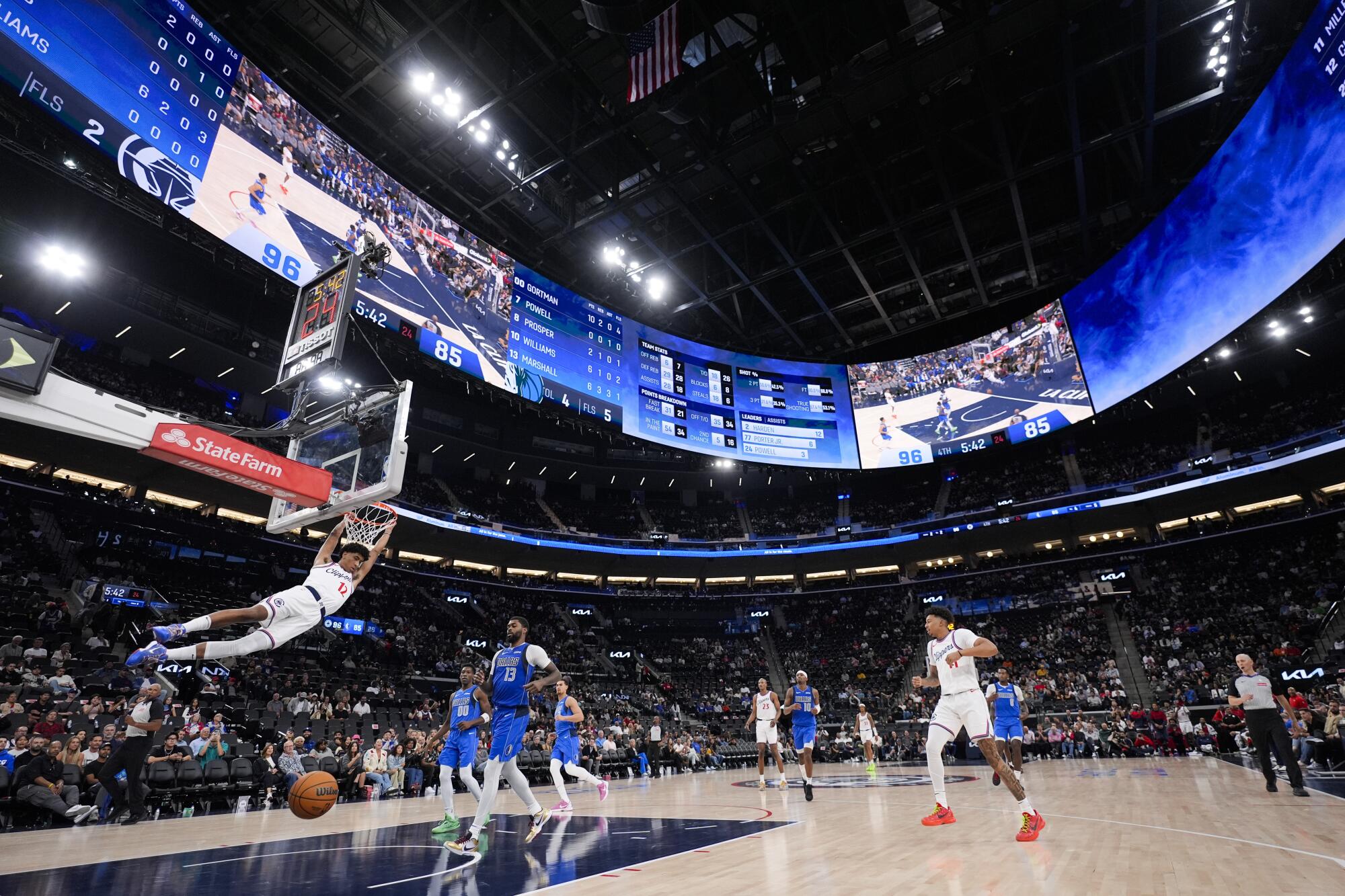 The Clippers' Cam Christie dunks the ball during a preseason game at the new Intuit Dome in Inglewood on Oct. 14.