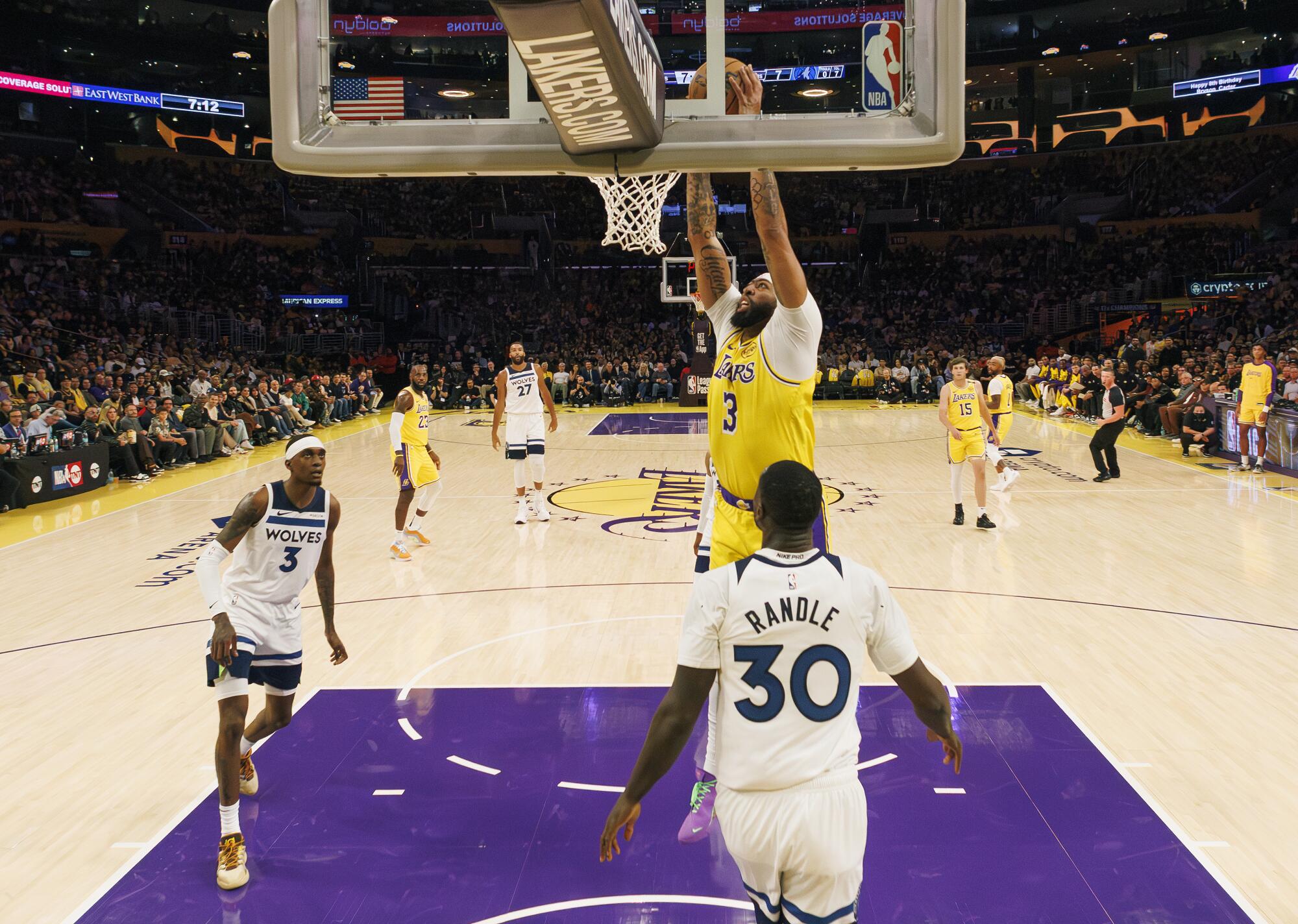 Lakers forward Anthony Davis dunks the ball, scoring two of his 36 points against the Minnesota Timberwolves 