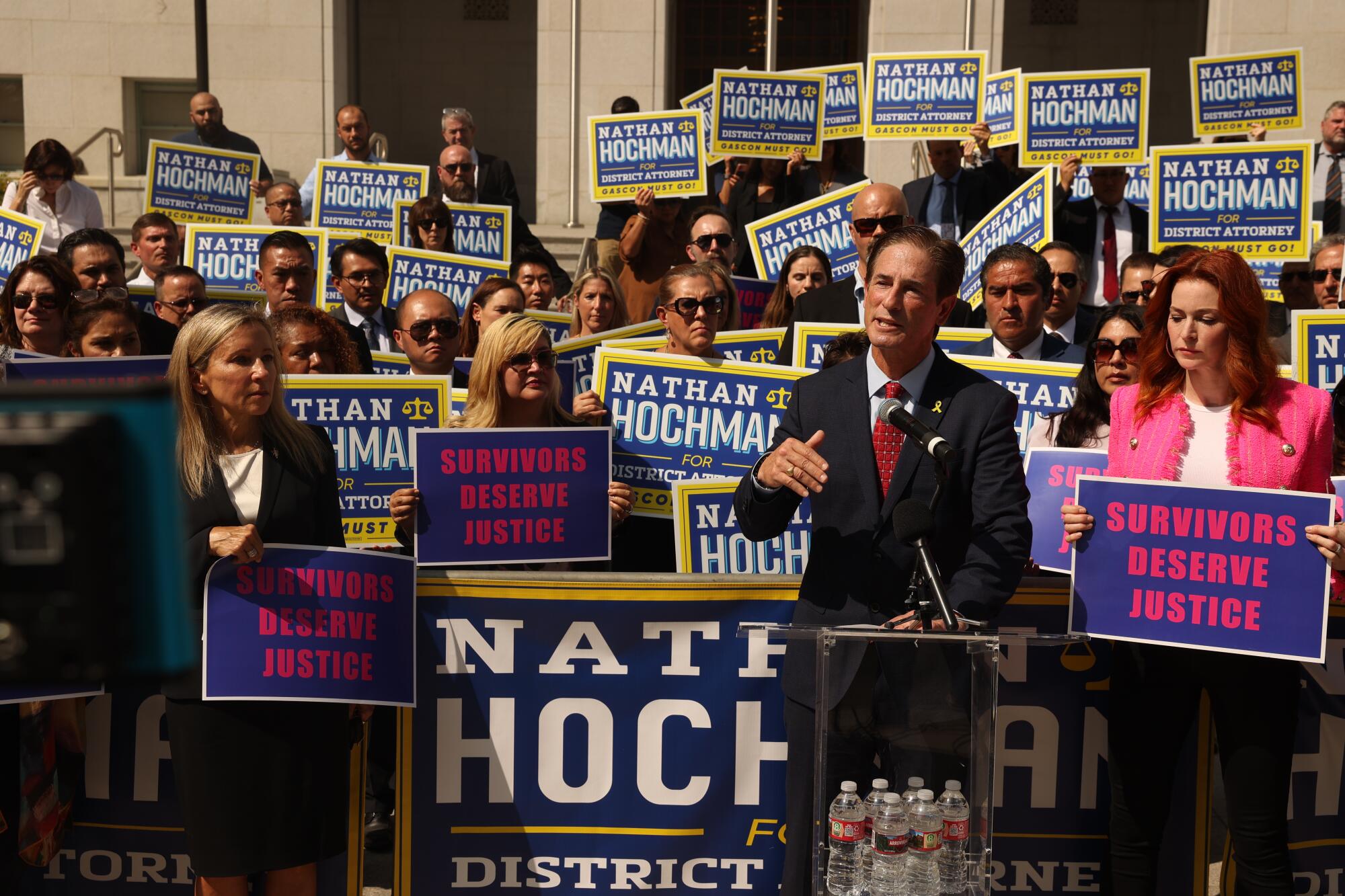 Nathan Hochman speaks with supporters.