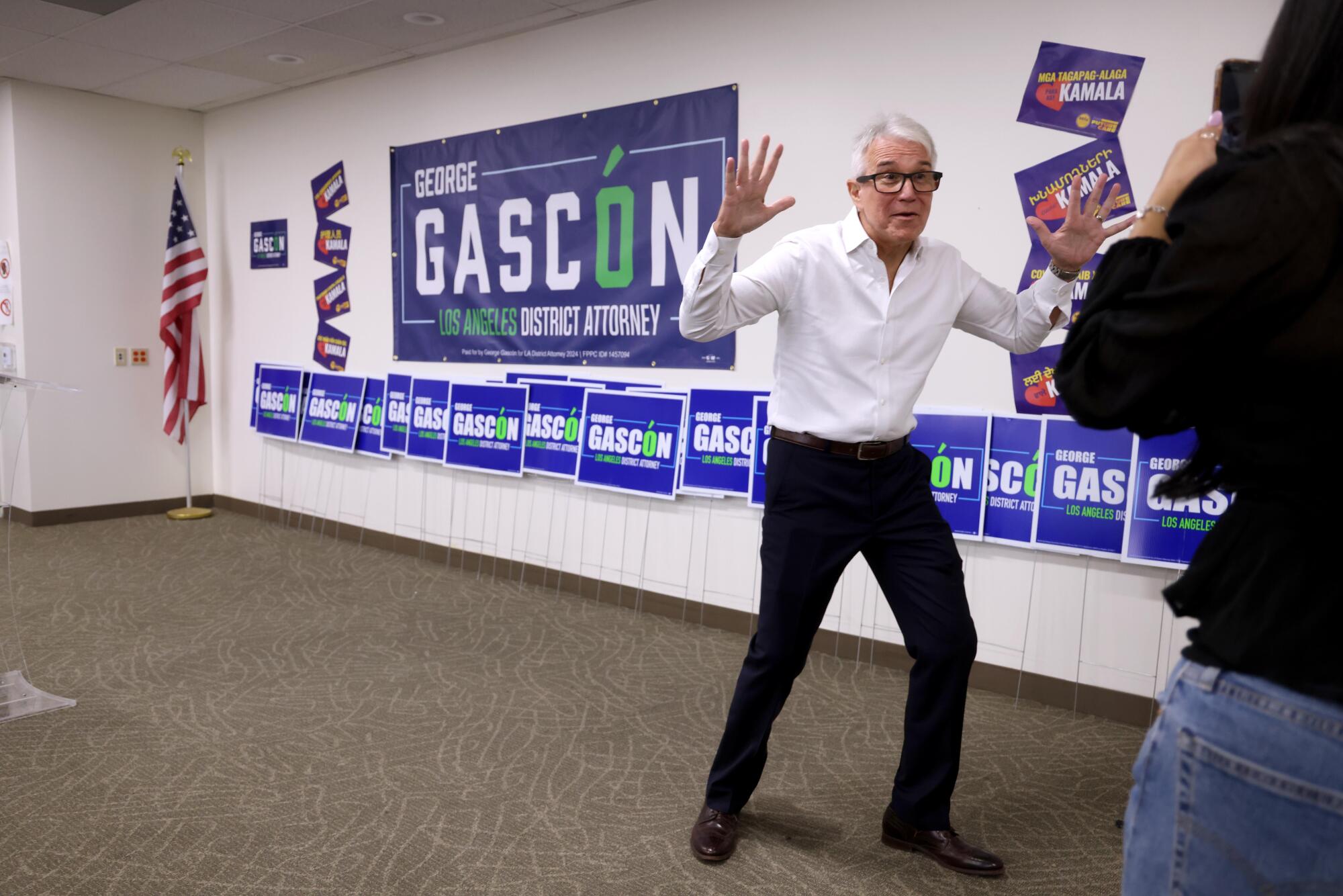 George Gascon gestures with his hands while being filmed for a TikTok video