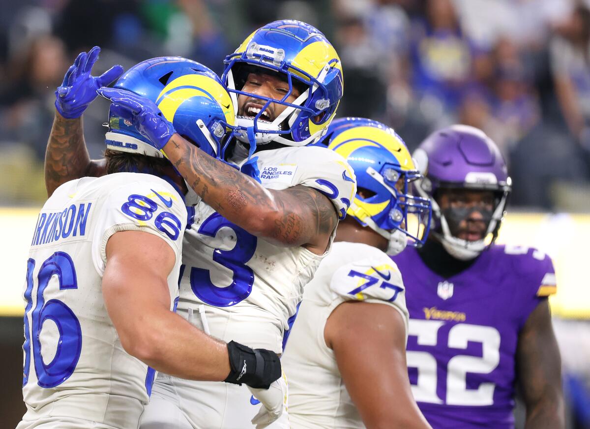 The Rams' Kyren Williams (right) celebrates his touchdown catch against the Vikings with Colby Parkinson.