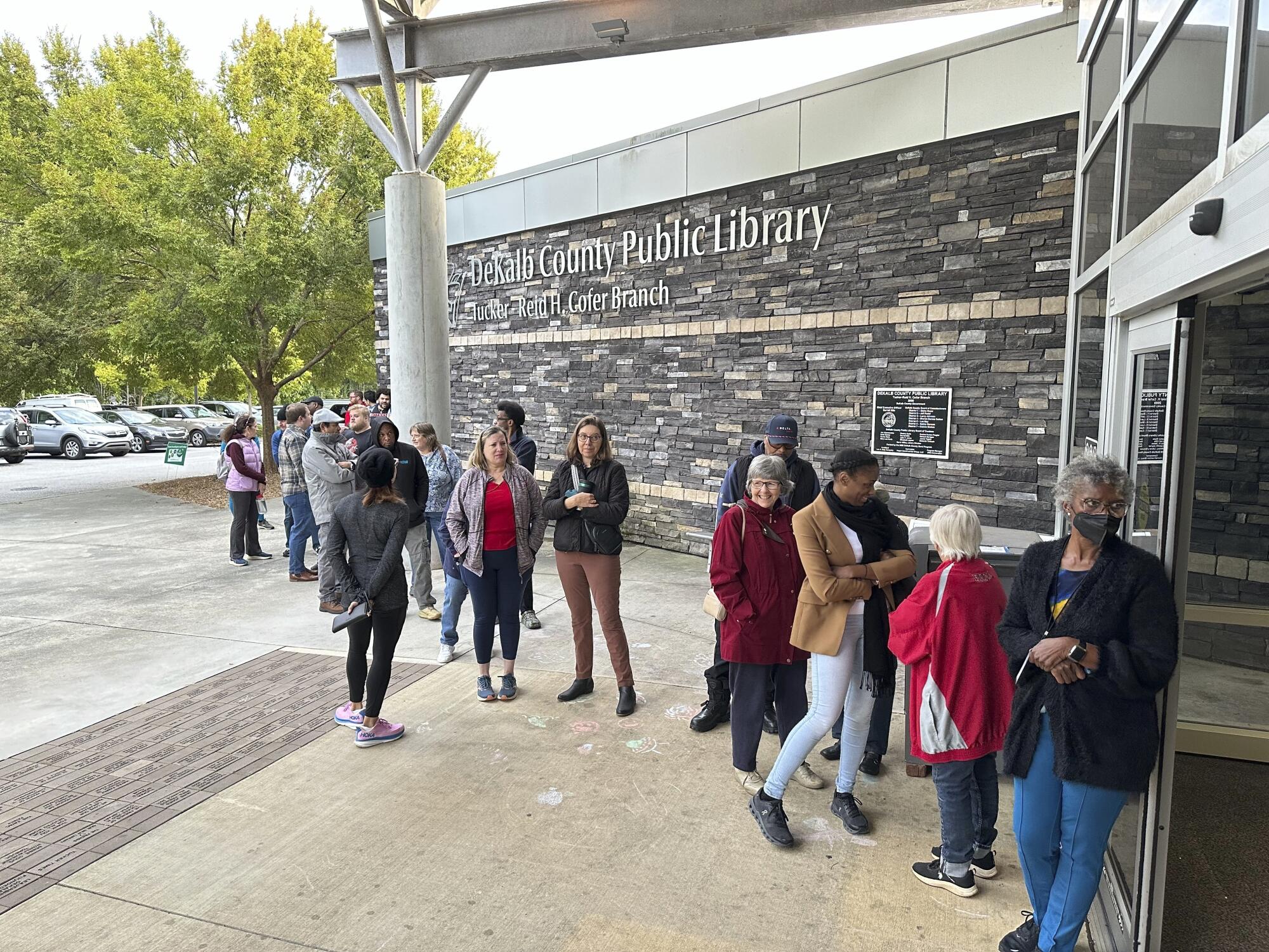 Voters line up outside a library in the Atlanta area