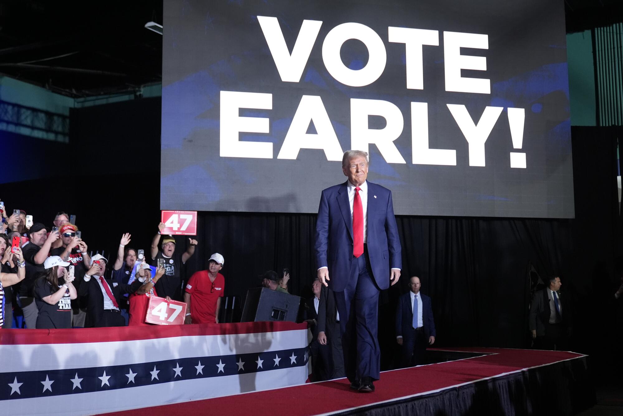 Donald Trump walking onstage at a rally