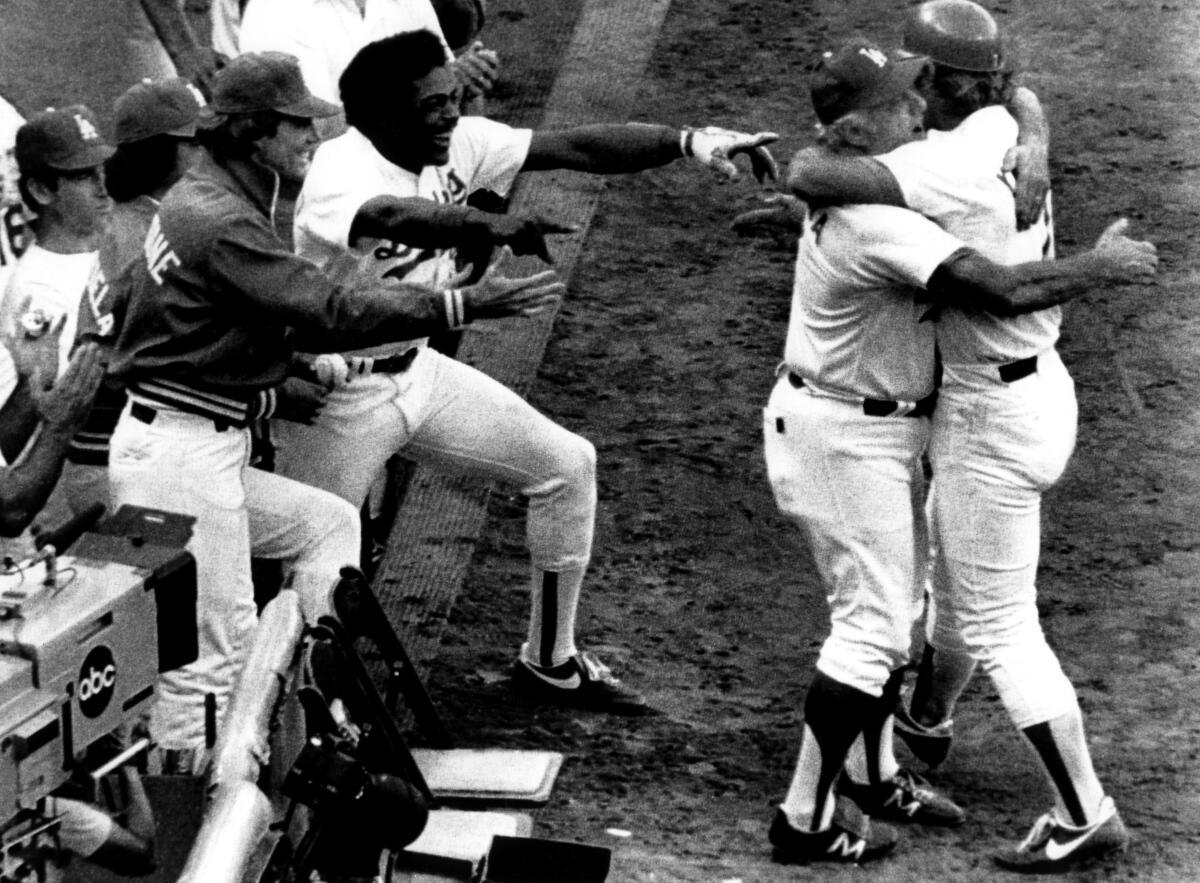 Dodgers manager Tommy Lasorda hugs Steve Yeager after he hit a home run in Game 5 of the 1981 World Series at Dodger Stadium.