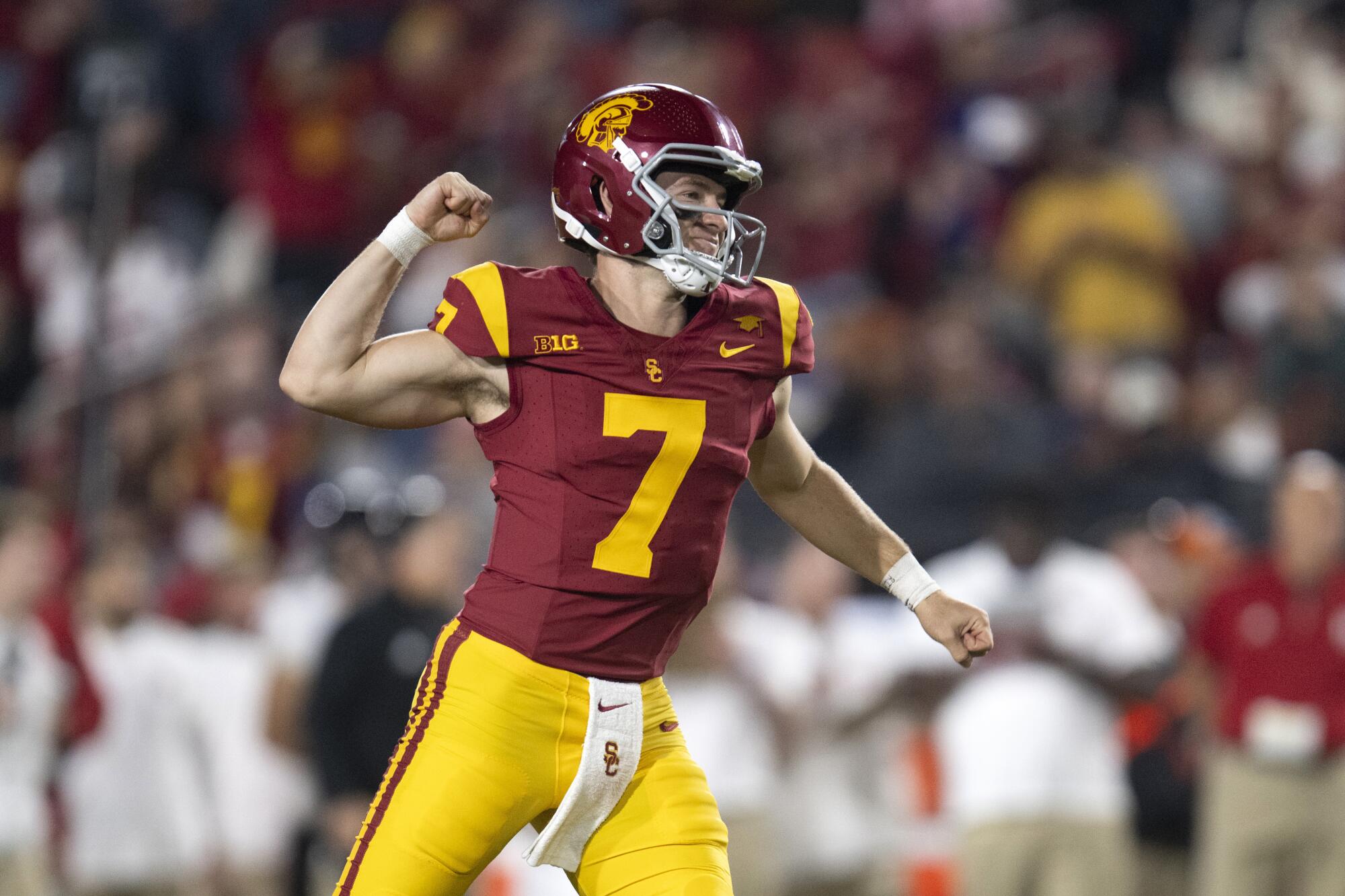 USC quarterback Miller Moss celebrates after the Trojans scored a touchdown against Rutgers Friday at the Coliseum.