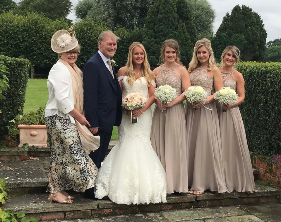 Sir David with his wife Julia Arnold at their daughter Alexandra's wedding. His daughters Florence, Katie and Sarah are bridesmaids