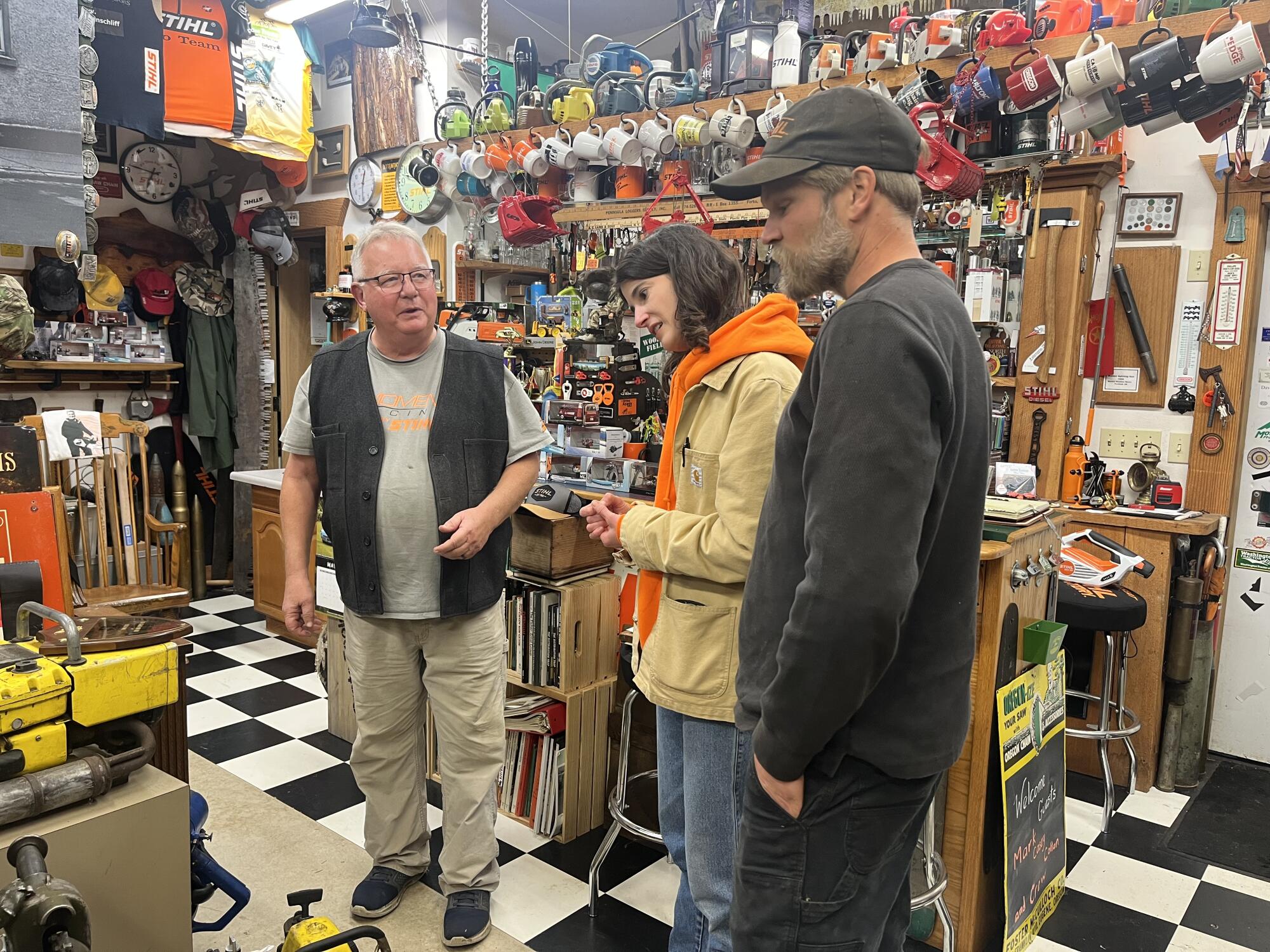 Marie Gluesenkamp Perez and her husband, Dean, in a chainsaw museum