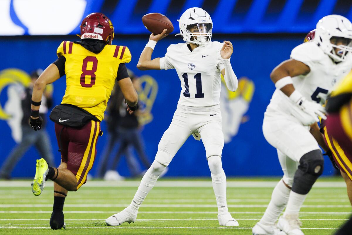 Garfield High School quarterback Robert Cedillo threw three touchdown passes against Roosevelt at SoFi Stadium.