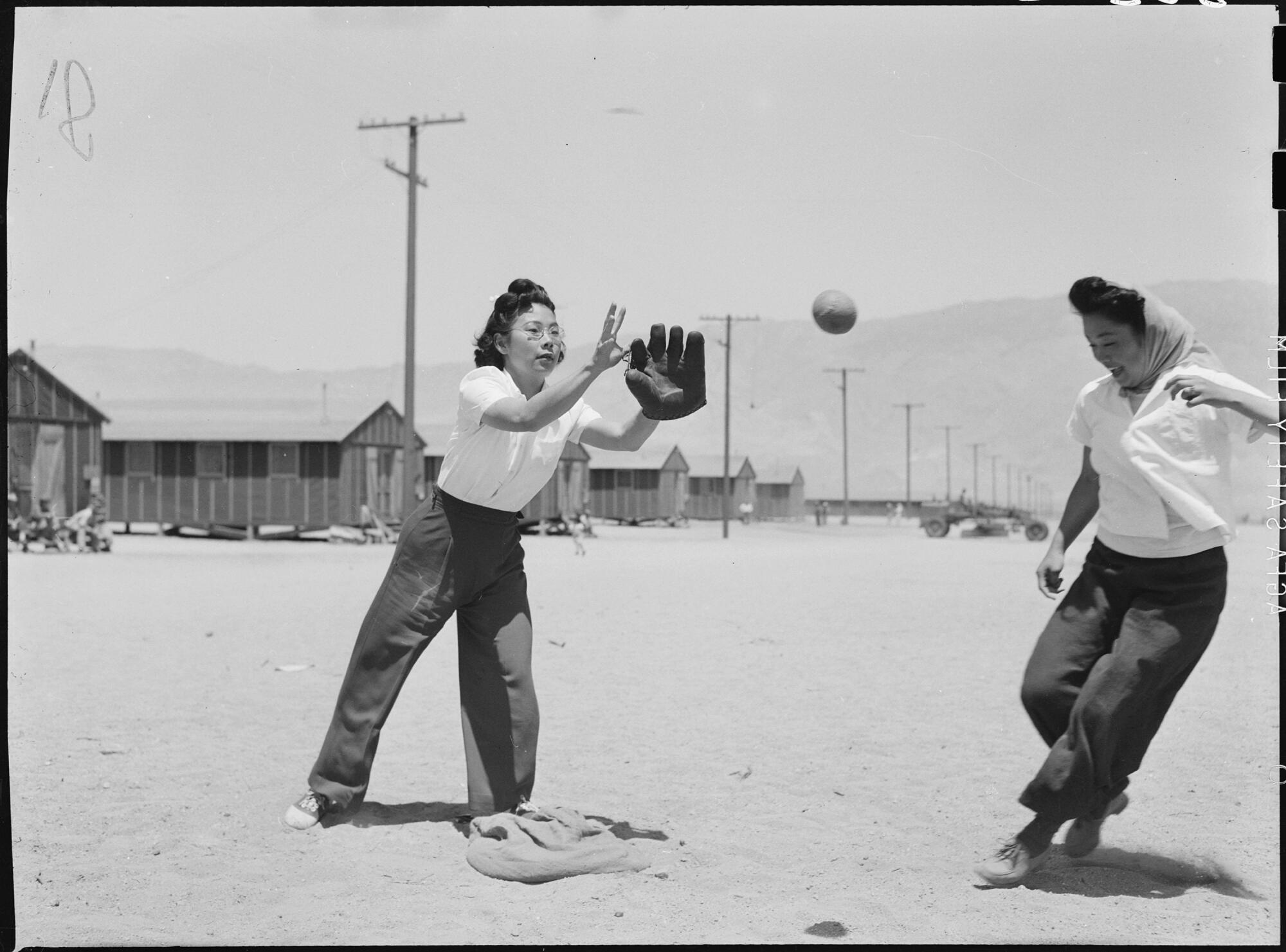 May 1942 photo of practice game between members of the Chick-a-dee soft ball team at the Manzanar Relocation Center.