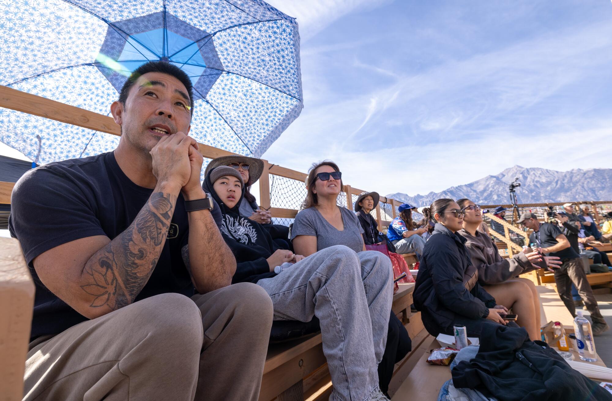 Fans watch game on the main baseball field at Manzanar.