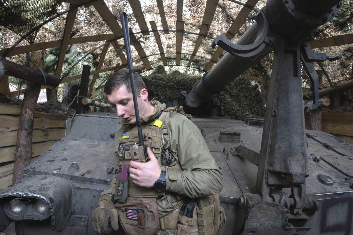 A Ukrainian officer talks by the radio on the frontline near Vovchansk, Kharkiv region, Ukraine