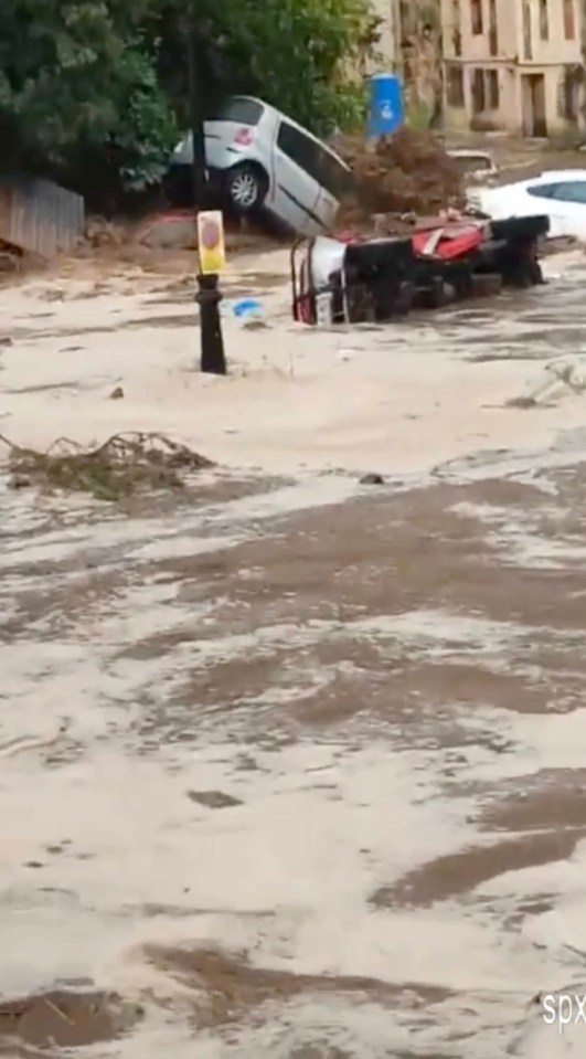 Cars were upended and swept away