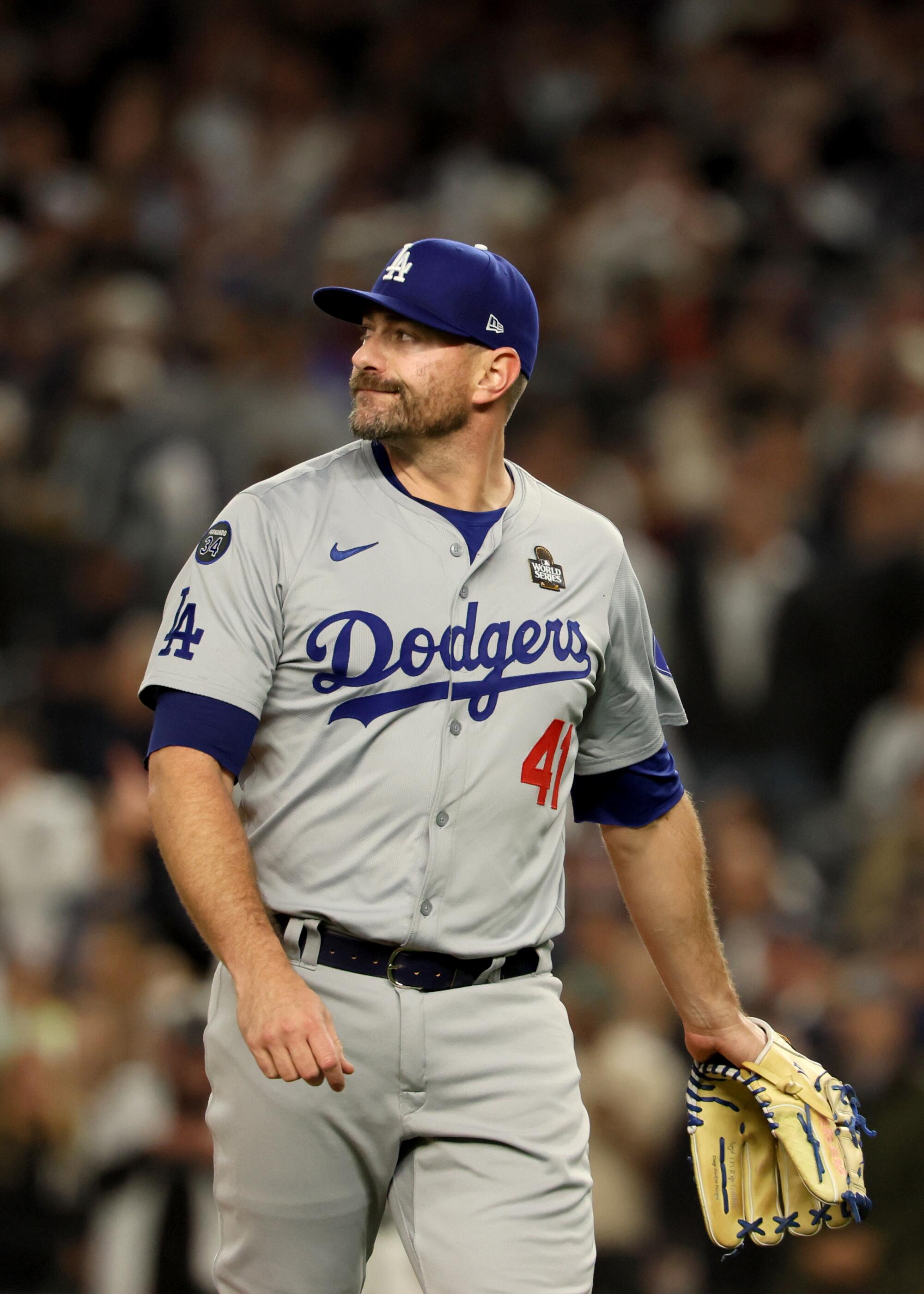 Dodgers pitcher Daniel Hudson reacts after giving up a grand slam to New York's Anthony Volpe.