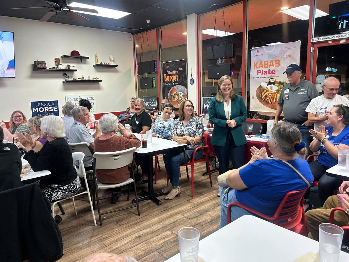 Jessica Morse gives a speech to supporters at 4 Heroes Grill 