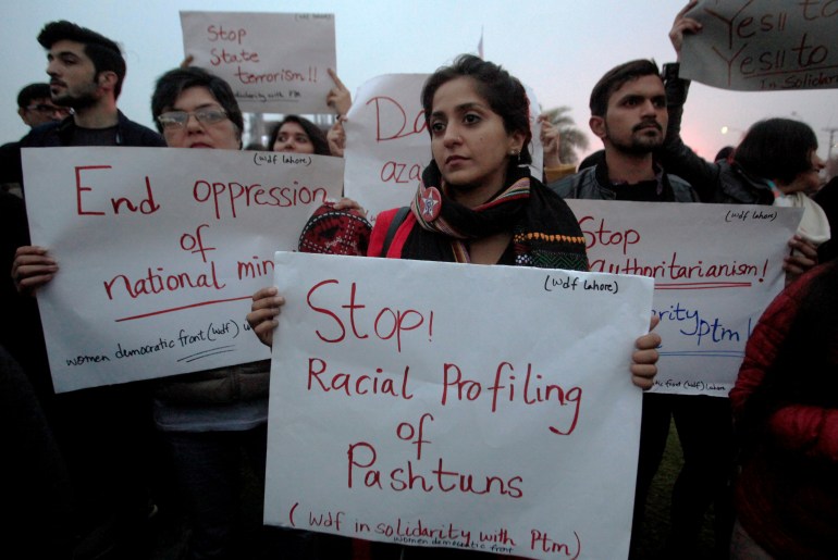 Supporters of Pashtun Tahafuz Movement (PTM) hold signs during a country-wide protests over the arrest of their leader and student activist Manzoor Pashteen, in Lahore, Pakistan January 28, 2020.