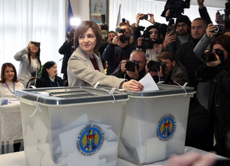 Moldova's incumbent President and presidential candidate Maia Sandu casts her ballots at a polling station