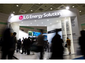 Attendees at an LG Energy Solution Co. booth displayed at the InterBattery exhibition in Seoul, South Korea, on Wednesday, March 6, 2024. The event will continue through March 8. Photographer: SeongJoon Cho/Bloomberg