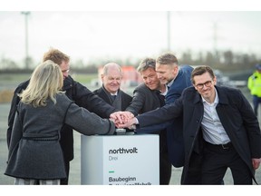 Olaf Scholz, center, and Robert Habeck, center right, at the Northvolt Drei groundbreaking ceremony in March. Photographer:  Gregor Fischer/Getty Images