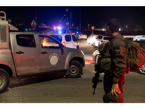 An Israeli soldier at the scene of a drone attack in Binyamina, Israel, on Oct. 13. Photographer: Amir Levy/Getty Images