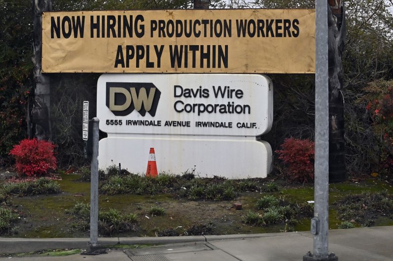 A "now hiring" banner is seen outside the Davis Wire Corporation in Irwindale, California on January 27, 2021. ADP reported on Wednesday that the private sector added 143,000 non-farm jobs to payrolls last month. File Photo by Jim Ruymen/UPI