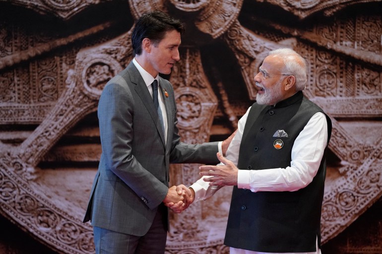 India's Prime Minister Narendra Modi shakes hands with Canada's Prime Minister Justin Trudeau.