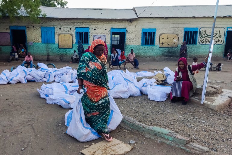 Woman carries aid bags