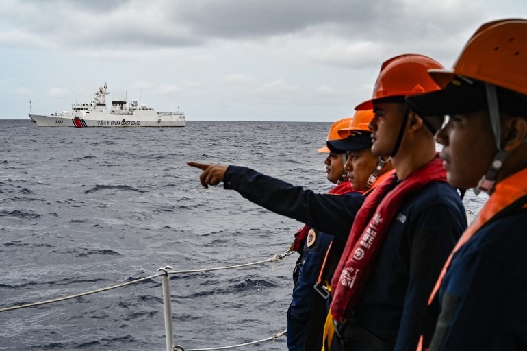 A China Coast Guard ship is seen from a Philippine Coast Guard vessel 