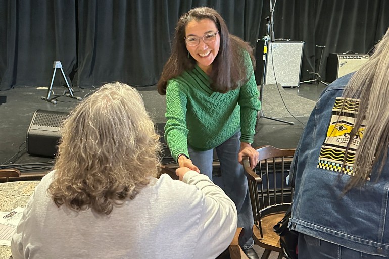 Mary Peltola shakes hands with a voter.