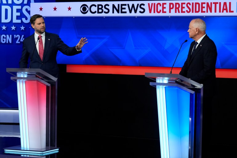 JD Vance and Tim Walz debate on a TV stage