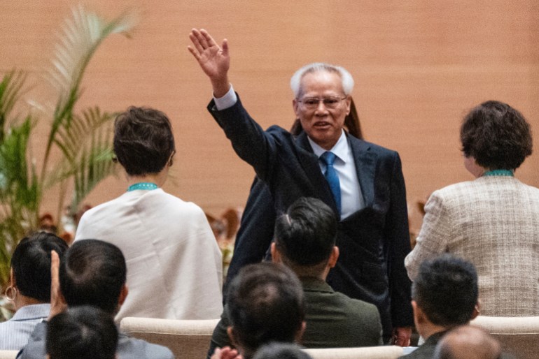 The sole candidate for the Macao chief executive post, Sam Hou Fai, the city's former top judge, celebrates after declaring his victory in the chief executive election in Macao, Sunday, Oct. 13, 2024