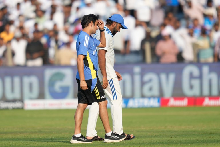 India's head coach Gautam Gambhir, left, and India's captain Rohit Sharma reacts after their lost against New Zealand on the day three of the second cricket test match at the Maharashtra Cricket Association Stadium , in Pune, India, Saturday, Oct. 26, 2024. (AP Photo/Rafiq Maqbool)