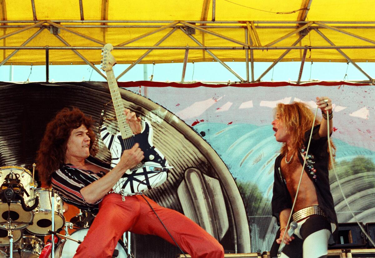 Eddie Van Halen, left, onstage with David Lee Roth in 1977