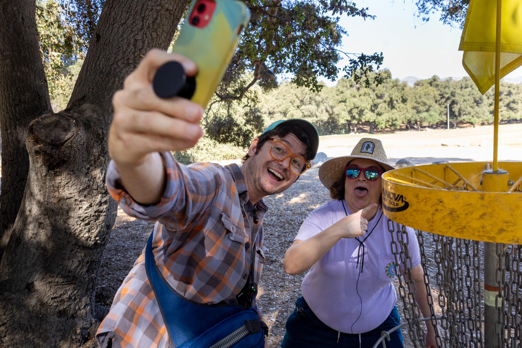 Comedian Allan McLeod takes a selfie with actress Betsy Sodaro in Pasadena.